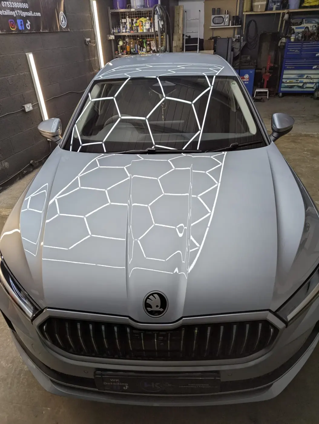 Grey Skoda under hex studio lights after polishing, detailed at our Stratford-upon-Avon studio