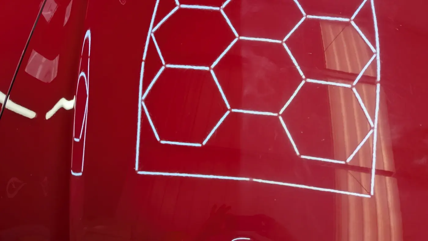 Red paint reflecting studio hex lights after swirl removal